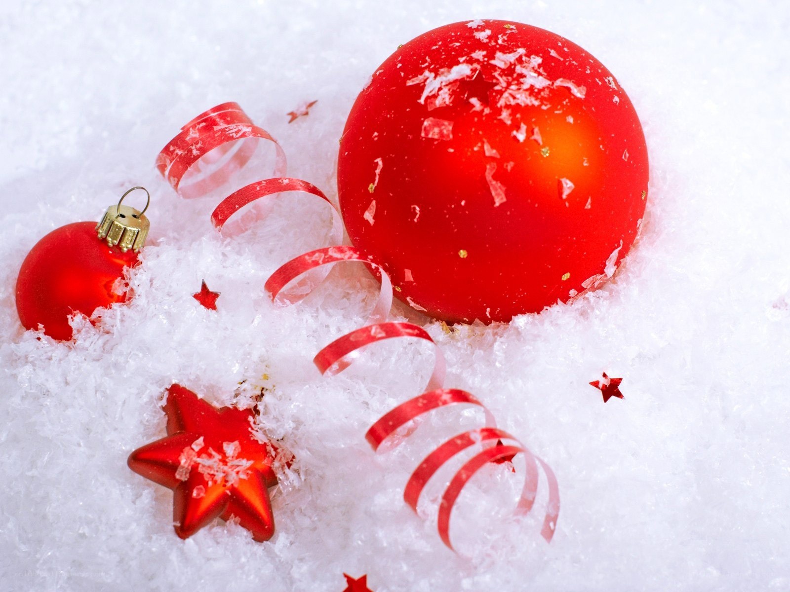 Red ornaments in snow