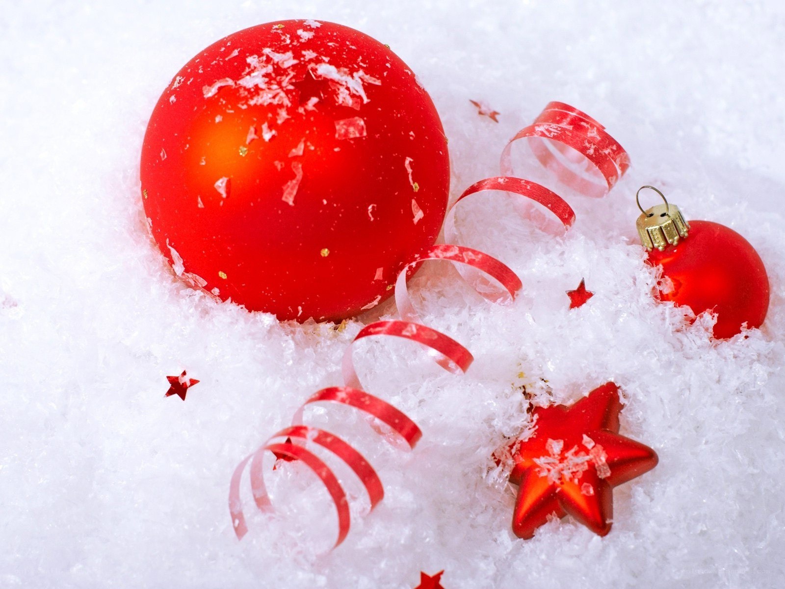 Red ornaments in snow