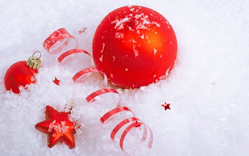 Red ornaments in snow