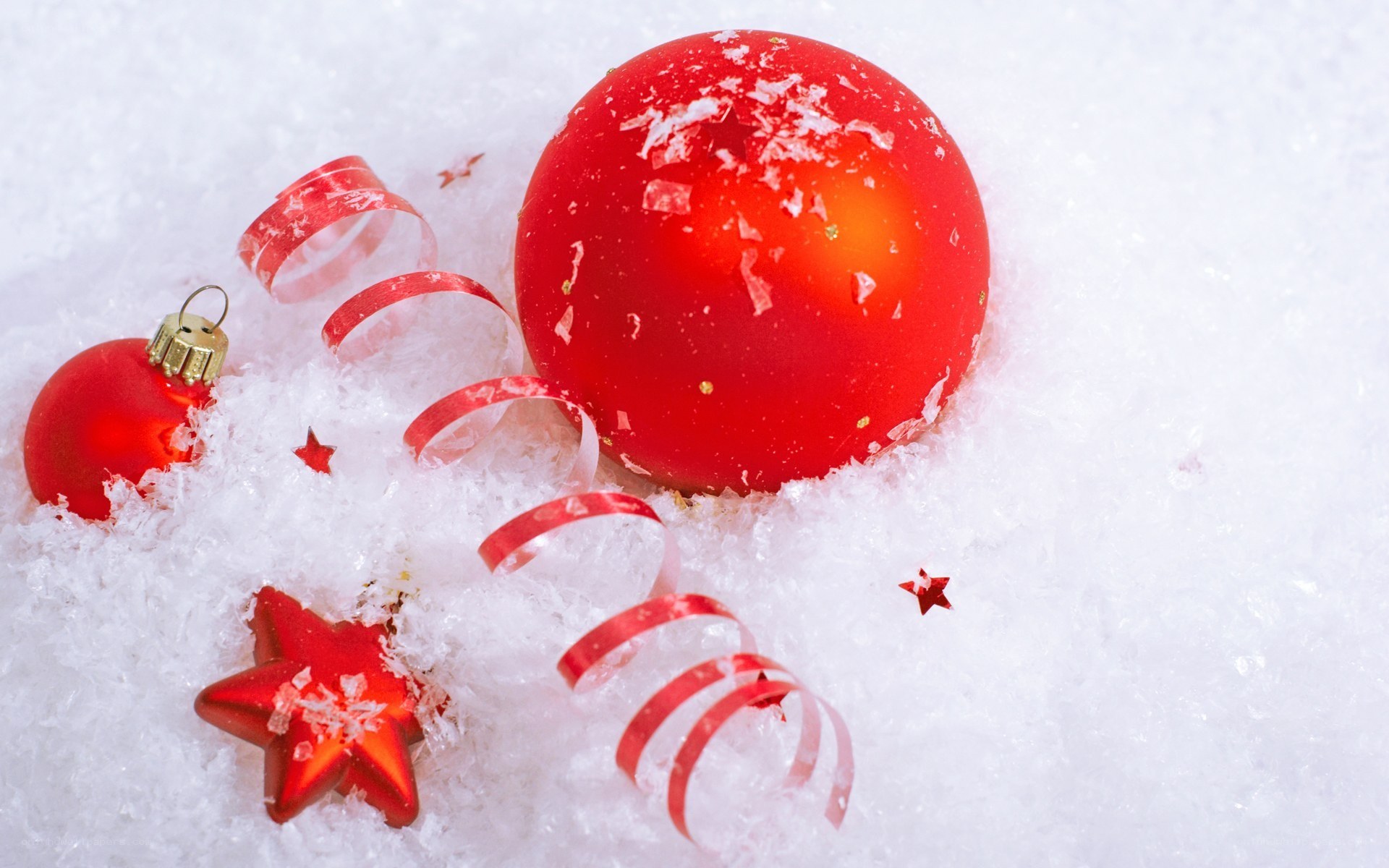 Red ornaments in snow