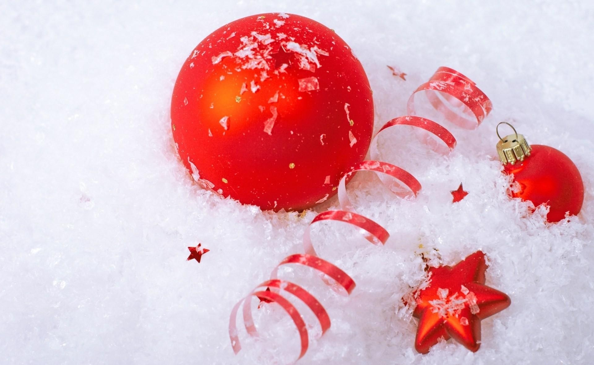 Red ornaments in snow