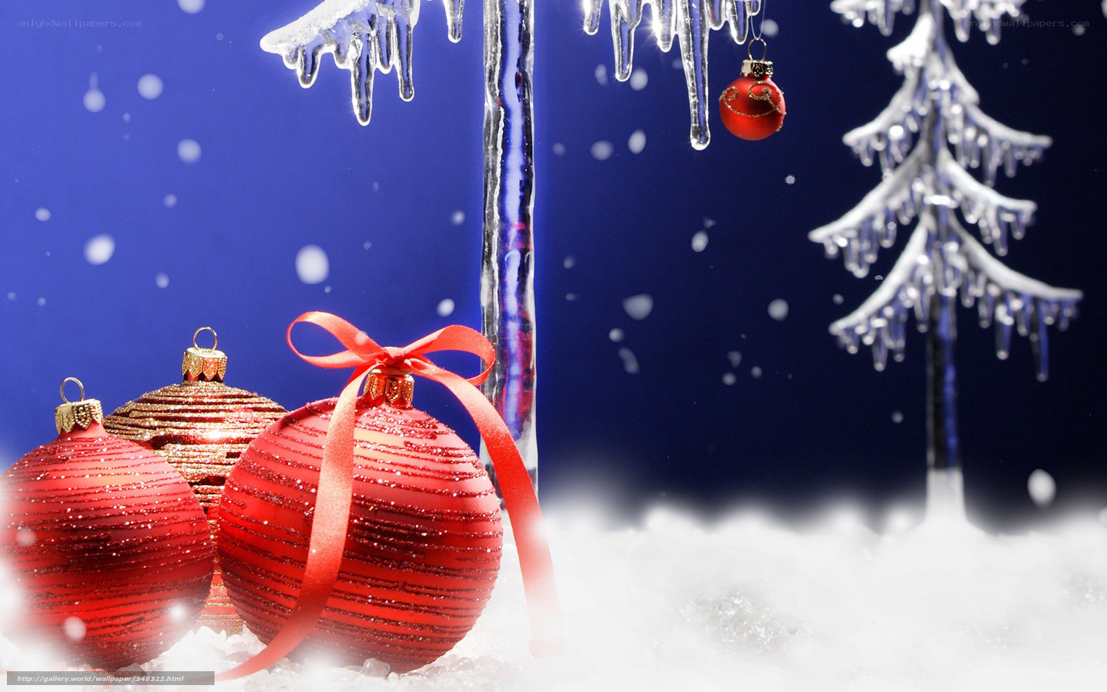 Red ornaments in snowy scene