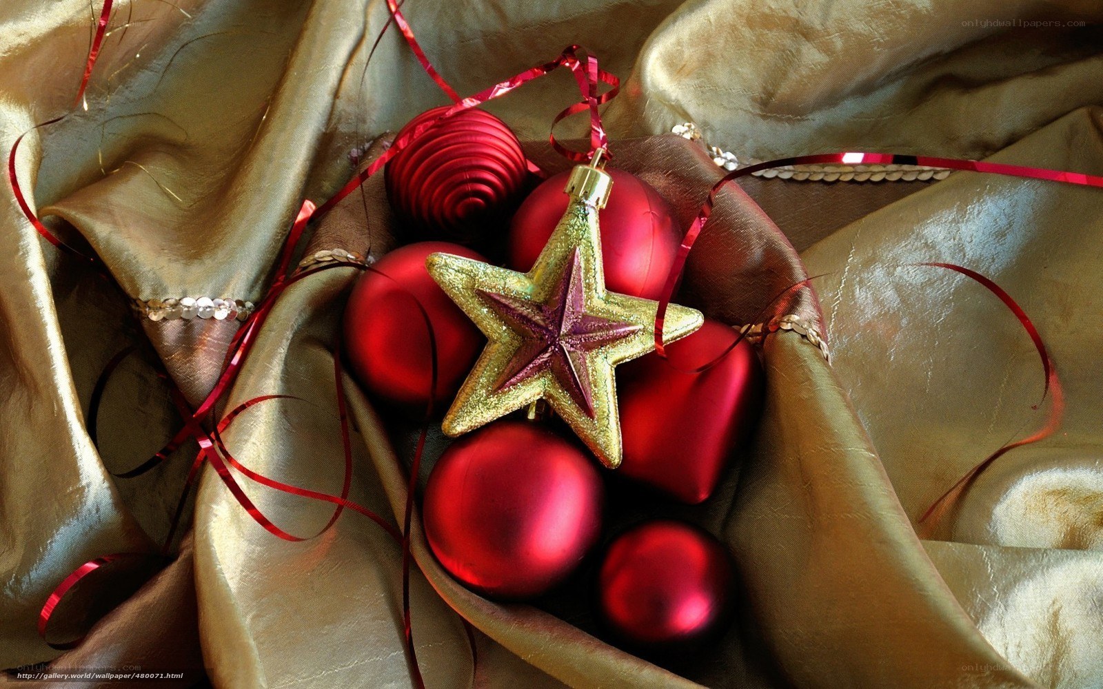 Red ornaments on gold fabric