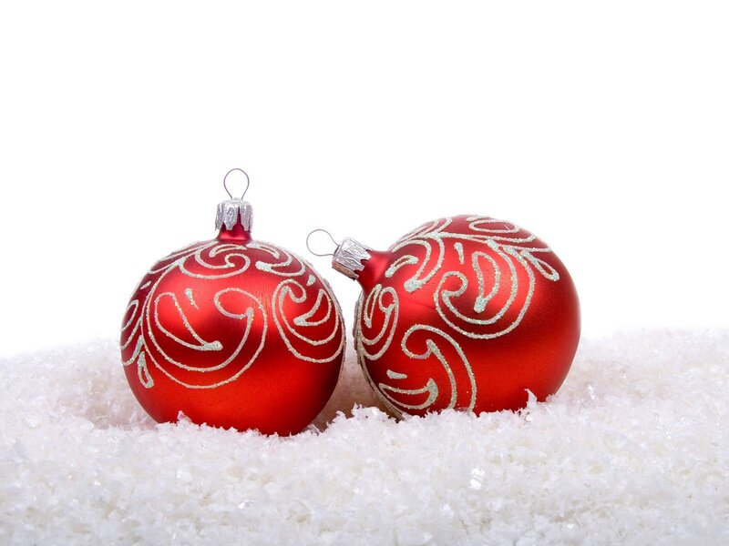 Red ornaments on snow