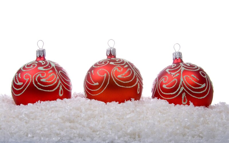 red ornaments on snow
