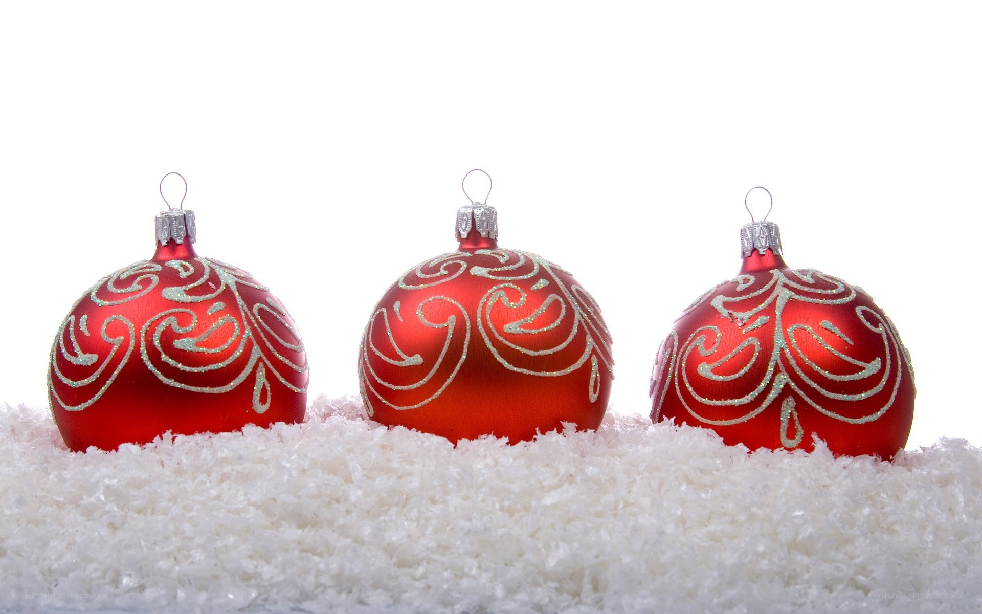 red ornaments on snow