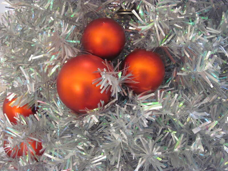 Red Ornaments on Tinsel — Festive