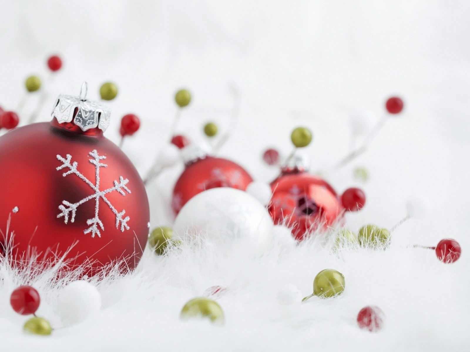 Red ornaments on white fluff