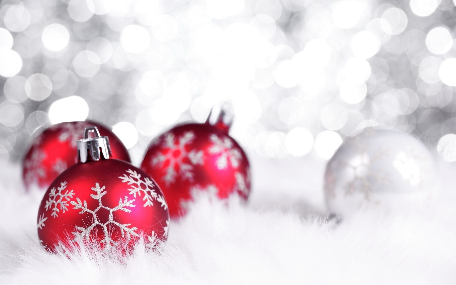 Red ornaments on white fur