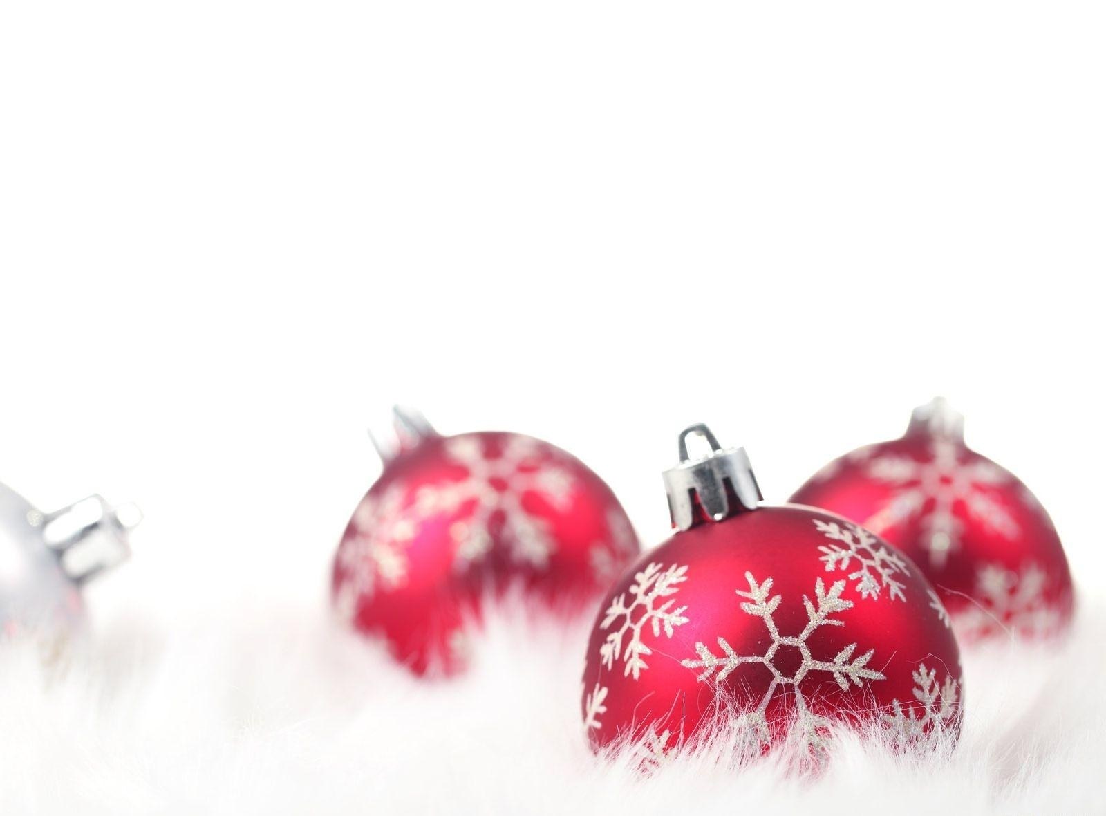Red ornaments on white fur