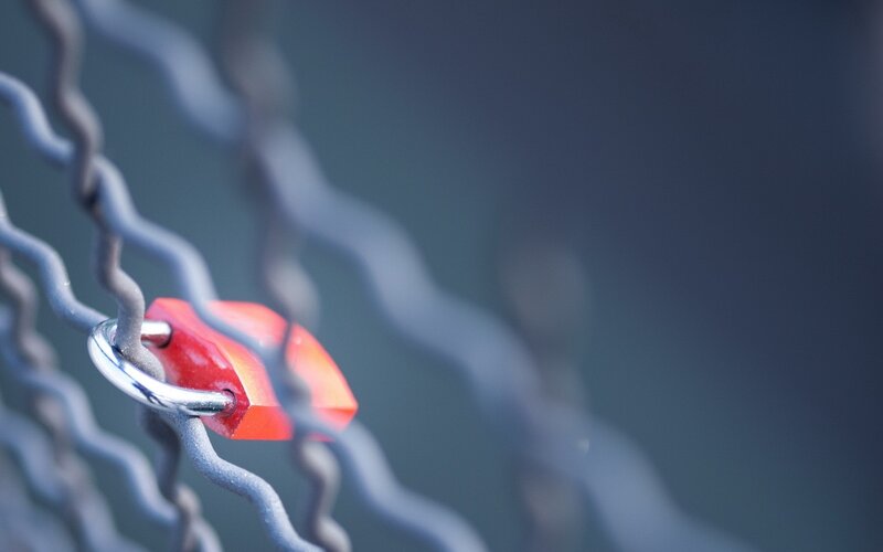 red padlock on chain link