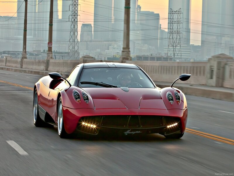 Red Pagani Huayra on city bridge