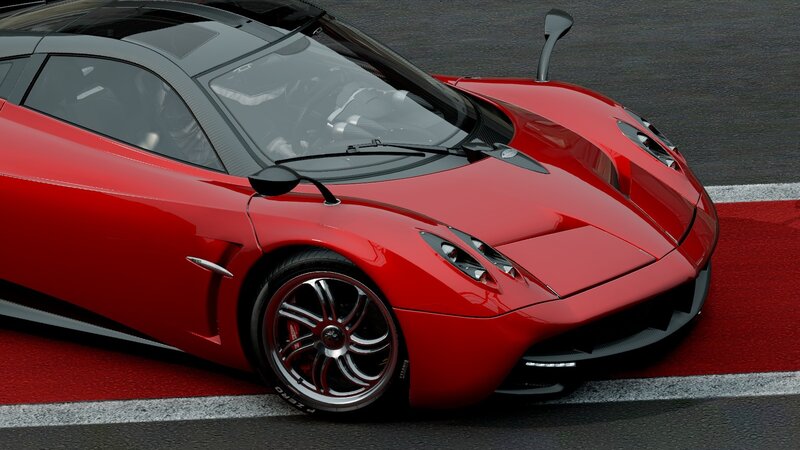 Red Pagani sports car on track
