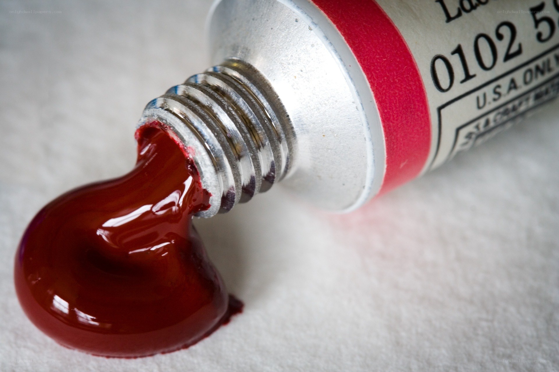 red paint tube close-up