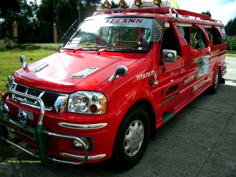 Red passenger van with custom modifications