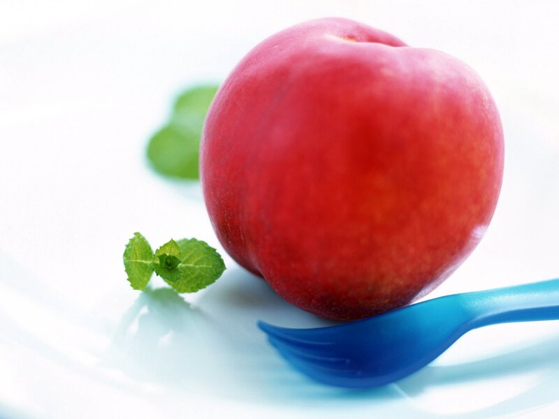 Red peach with mint and fork