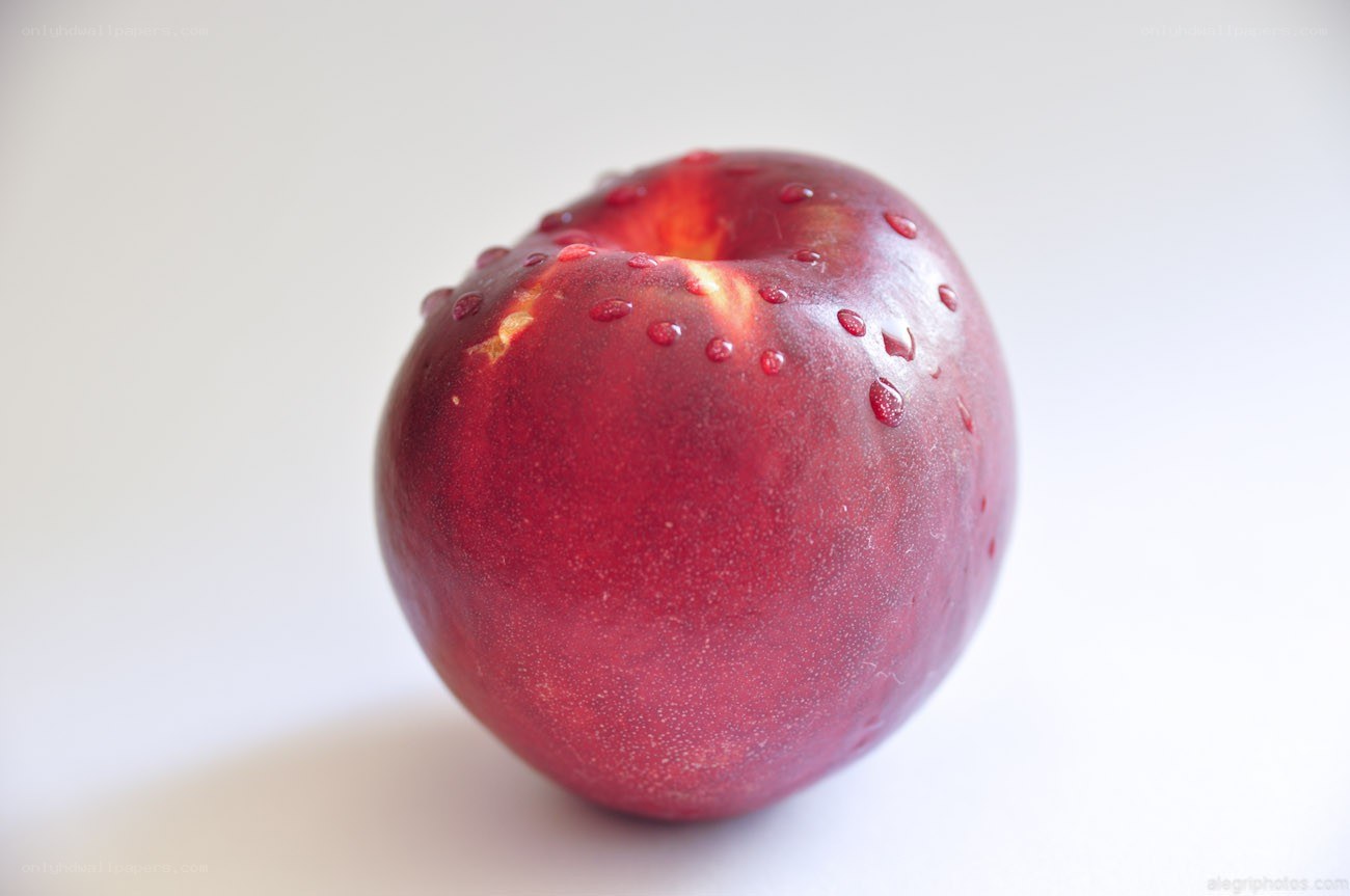 red peach with water droplets
