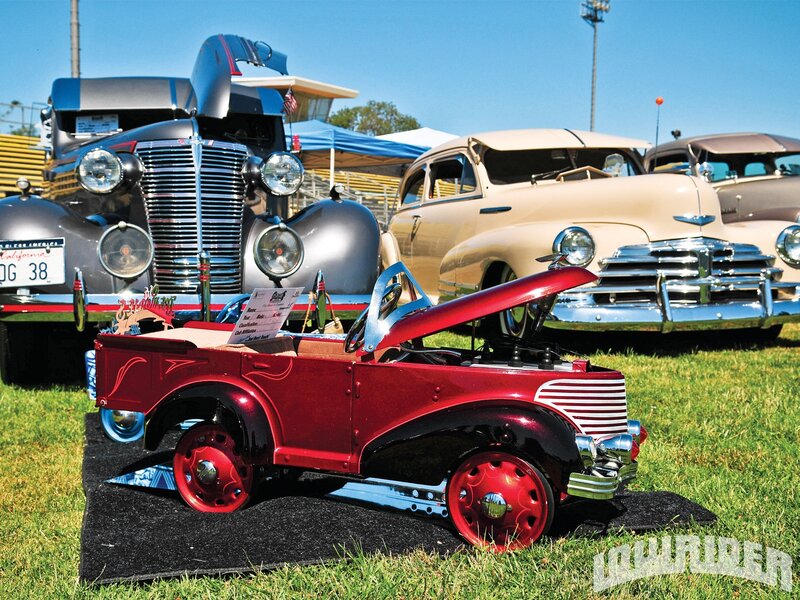 Red Pedal Car on Grass