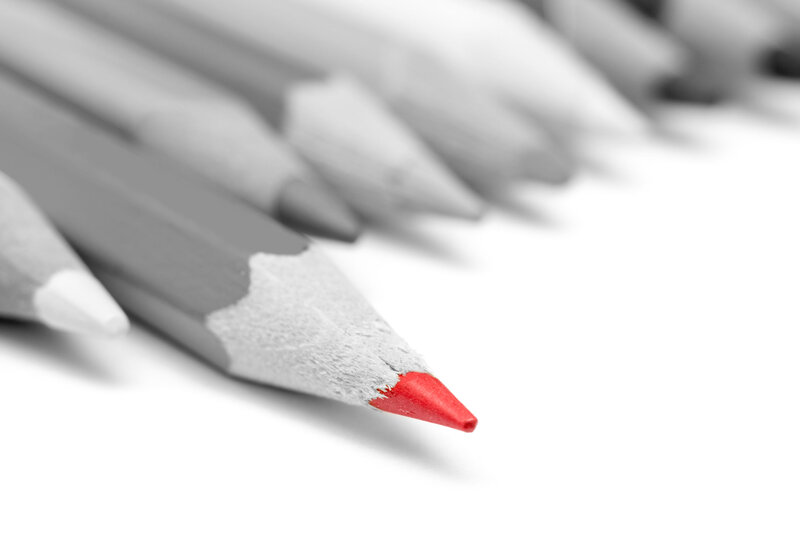 Red Pencil Among Gray Pencils