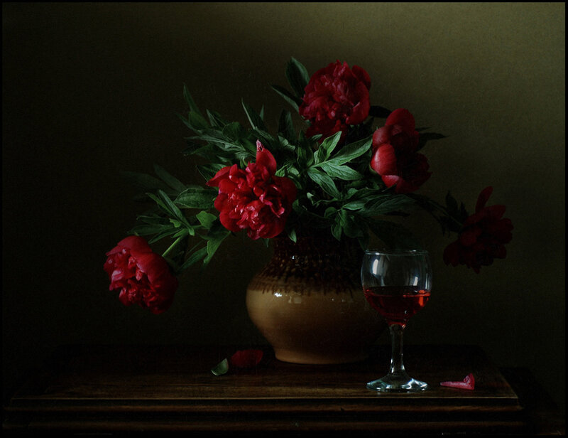 Red peonies and wine glass