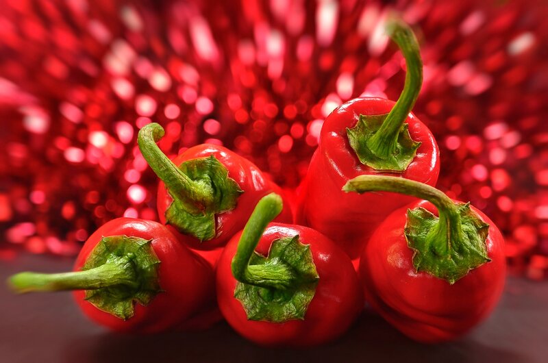 Red Peppers on Red Background