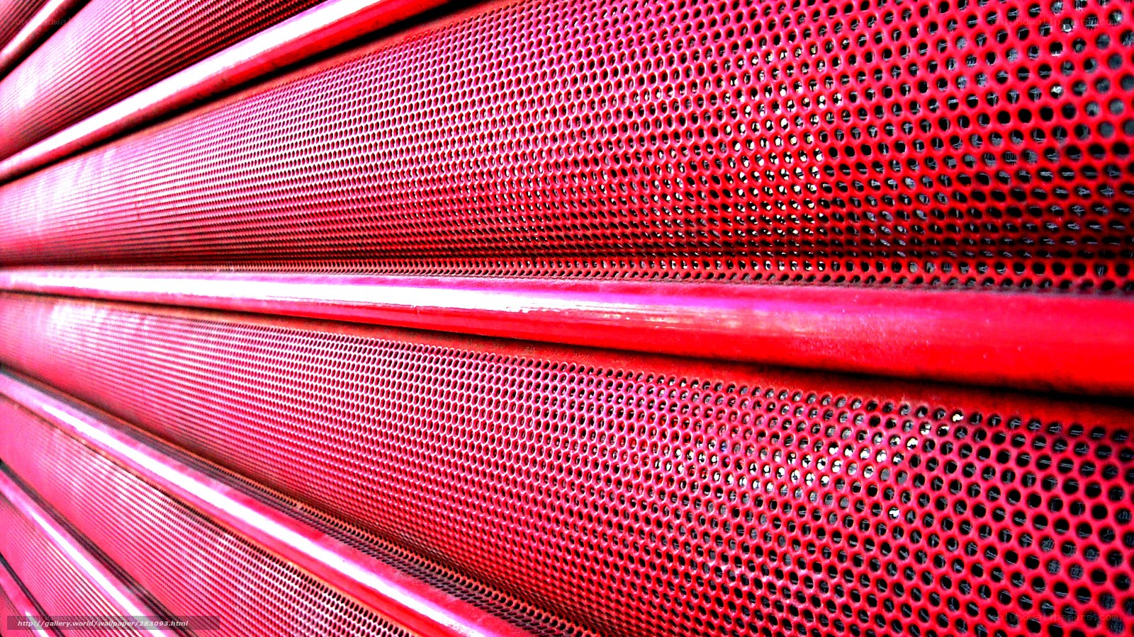 Red perforated metal surface