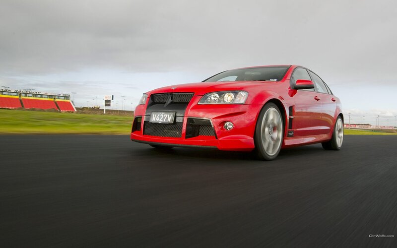 red performance car on racetrack