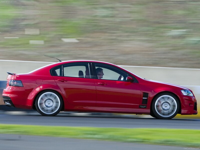 Red Performance Sedan — Dynamic, Afternoon, Photograph, Driver