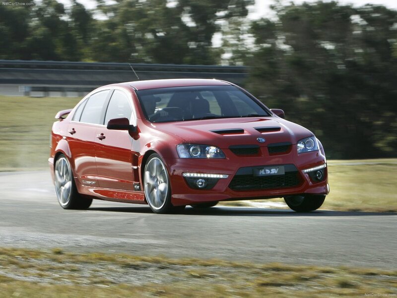 Red Performance Sedan — Dynamic, Afternoon, Photograph