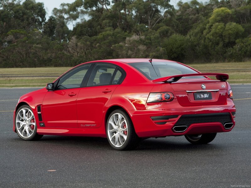 Red Performance Sedan — Dynamic, Afternoon, Photograph, Trees