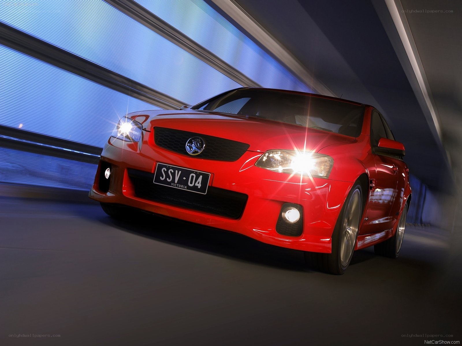 red performance sedan in tunnel