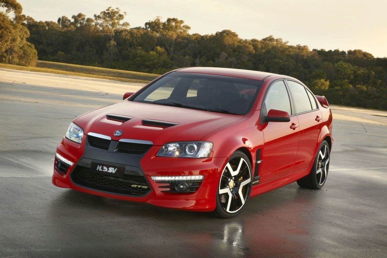red performance sedan on track