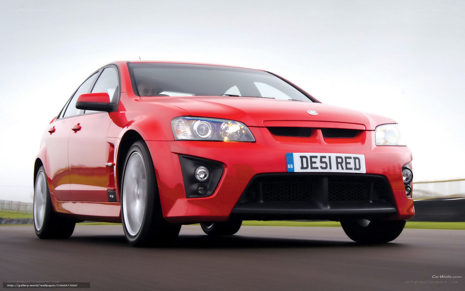 red performance sedan on track