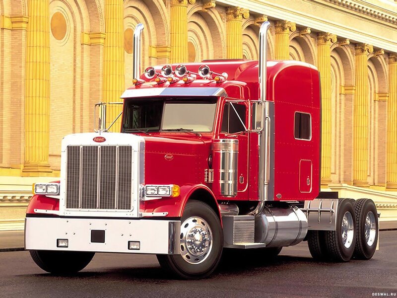 Red Peterbilt truck in front of building
