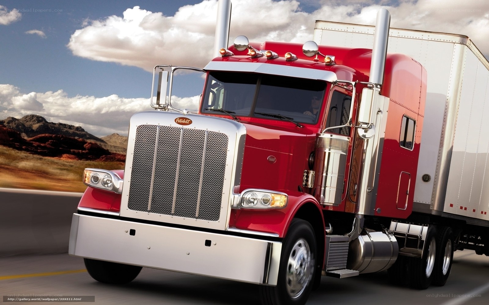 Red Peterbilt truck on highway