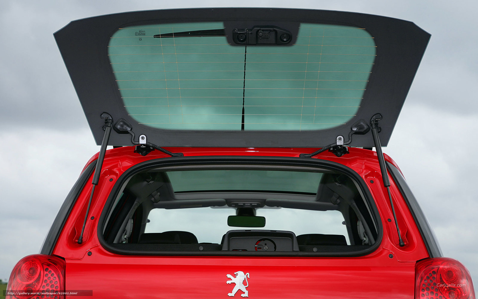 Red Peugeot 207 hatchback