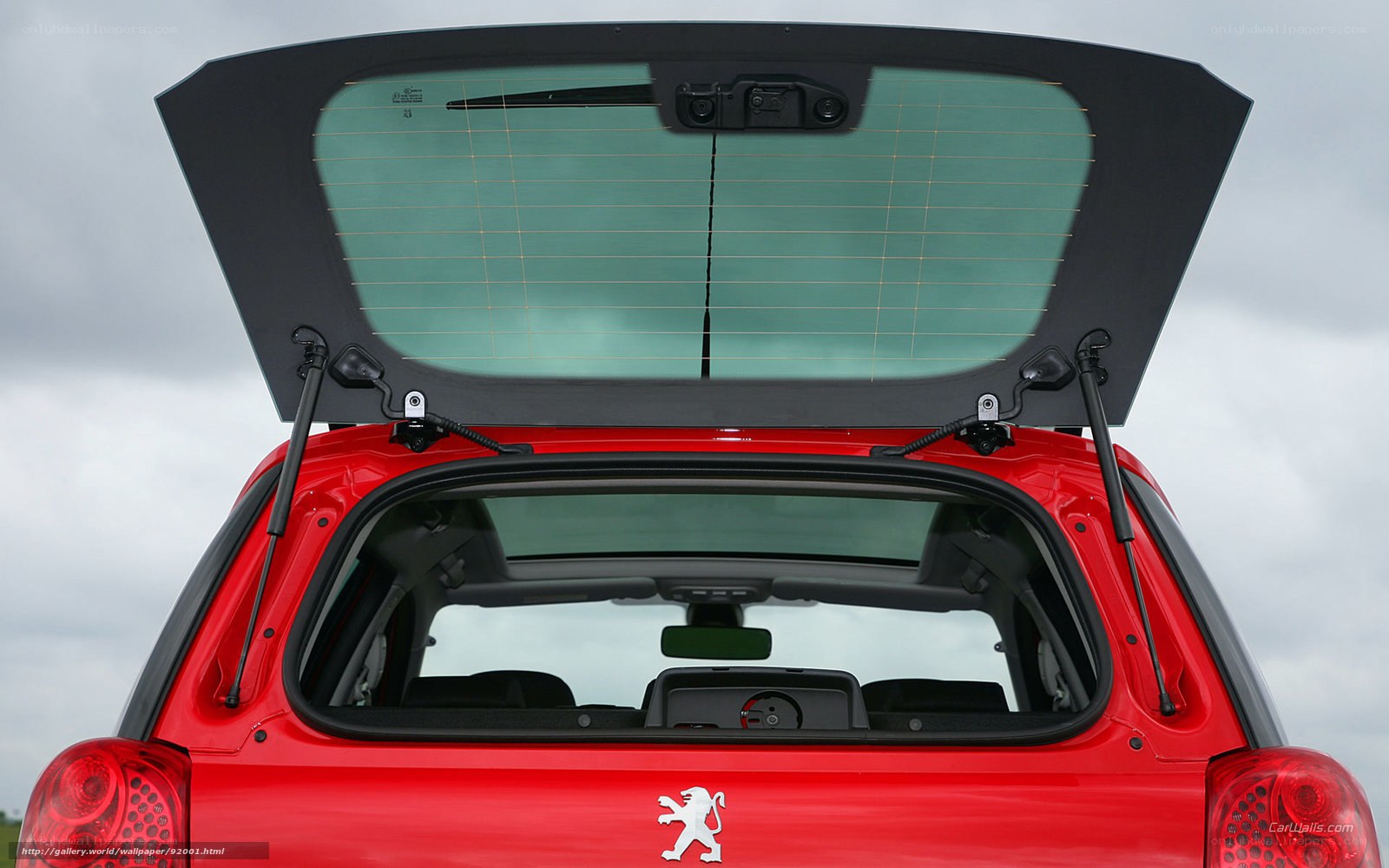Red Peugeot 207 hatchback