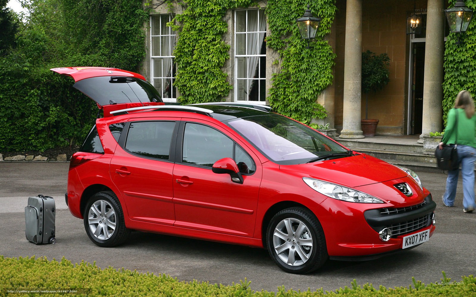 Red Peugeot 207 SW parked