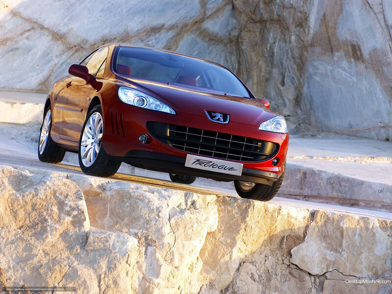 Red Peugeot 308 RC on rocky cliff