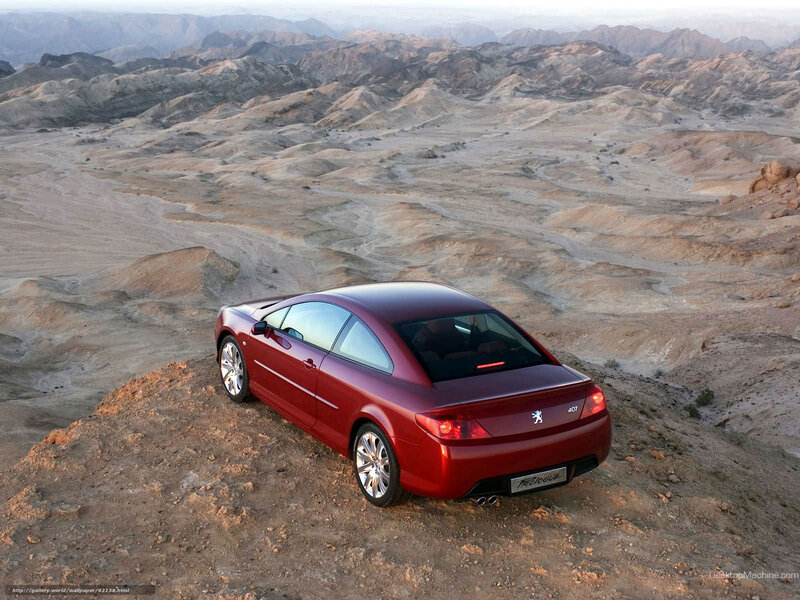 Red Peugeot 407 Coupe in desert