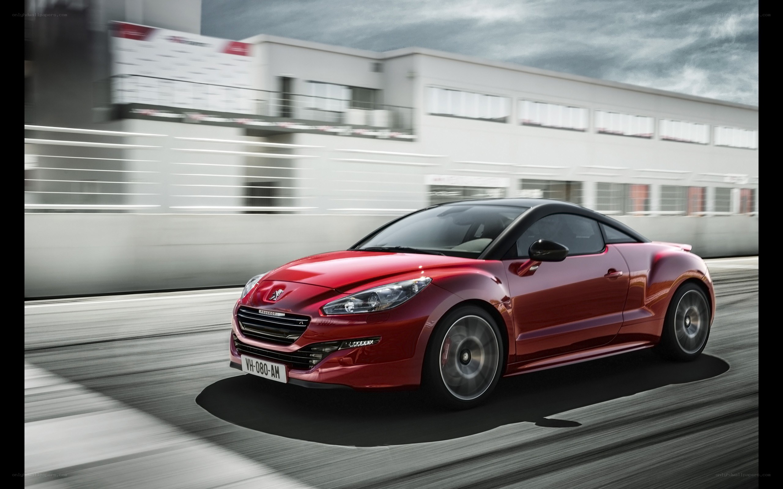 Red Peugeot RCZ in motion
