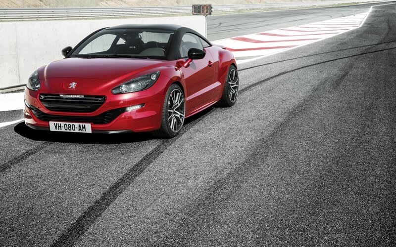 Red Peugeot RCZ on a racetrack