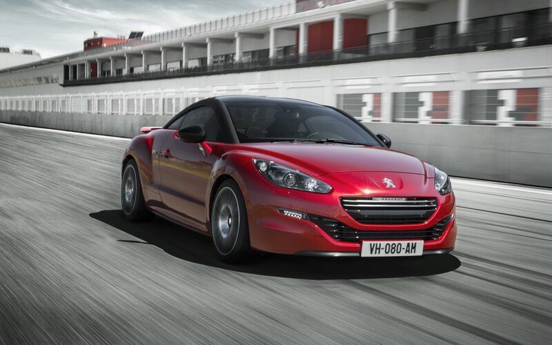 Red Peugeot RCZ on a racetrack