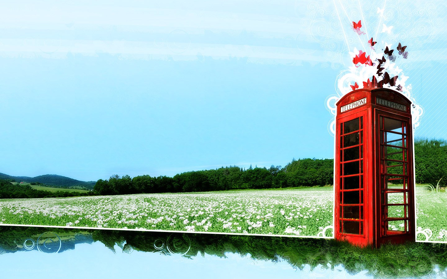 Red phone booth in a field