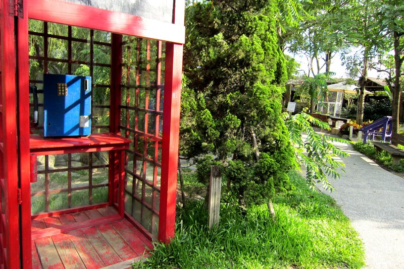 Red Phone Booth in Garden