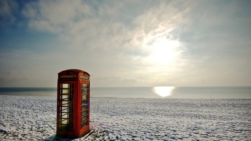 Red Phone Booth on Beach