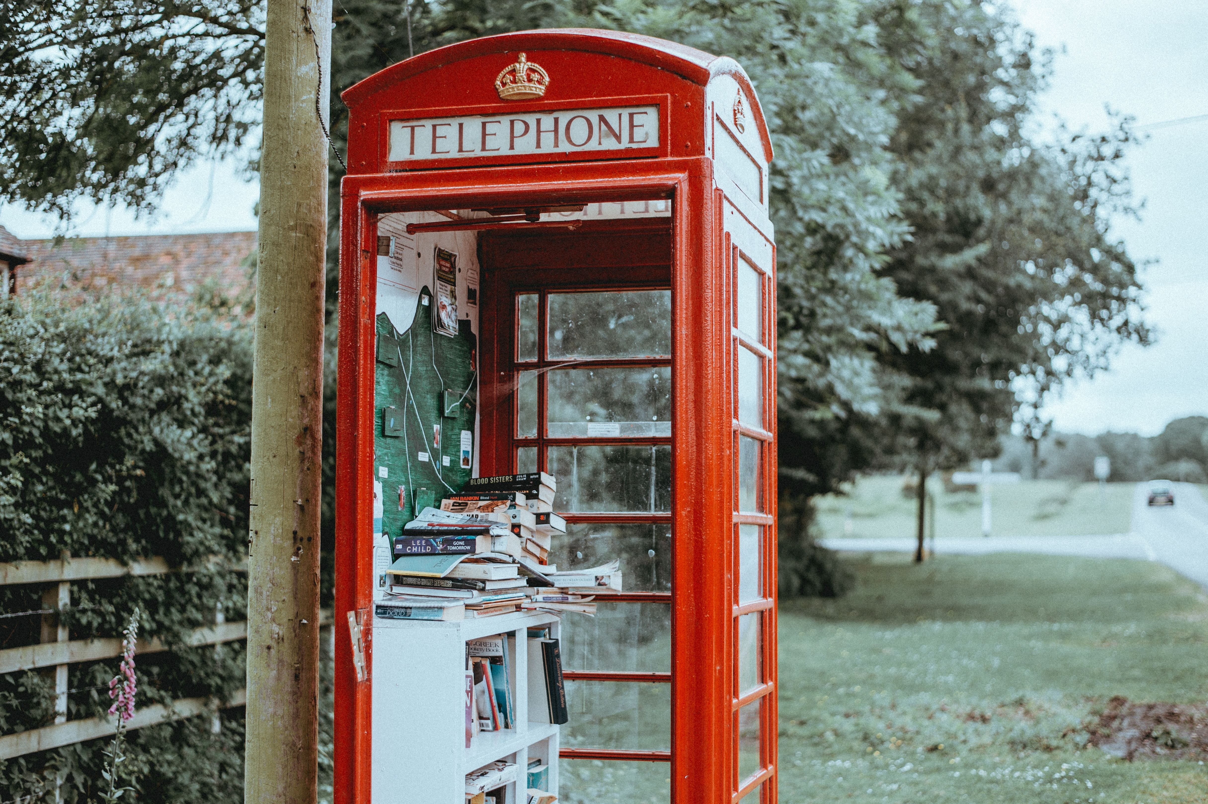 Red phone booth with books