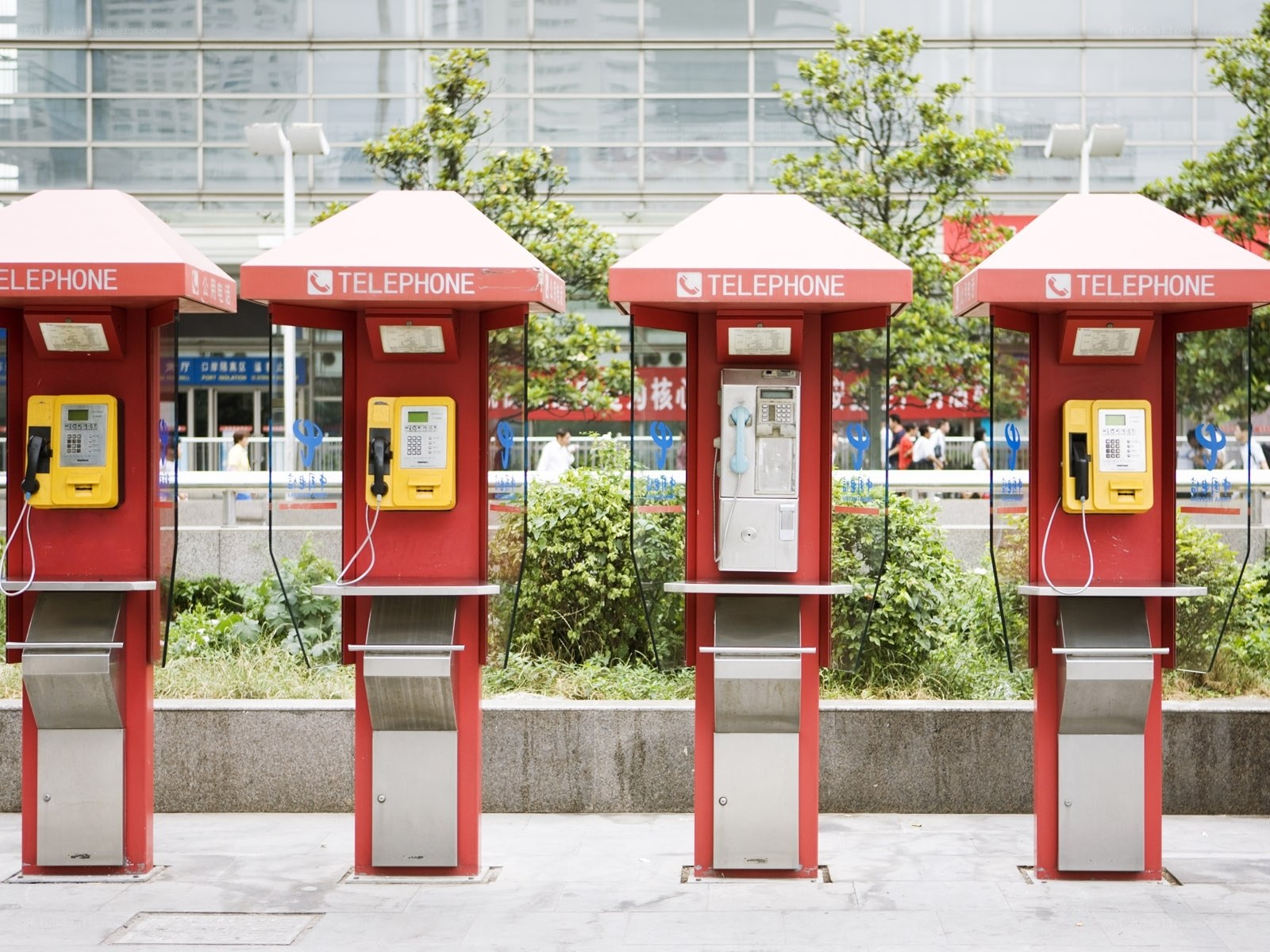 Red phone booths in a city