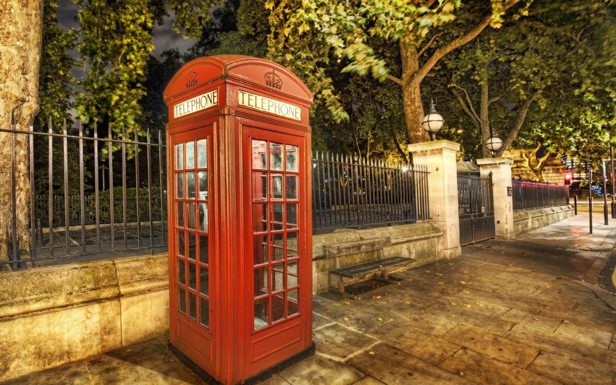 Red phone box at night