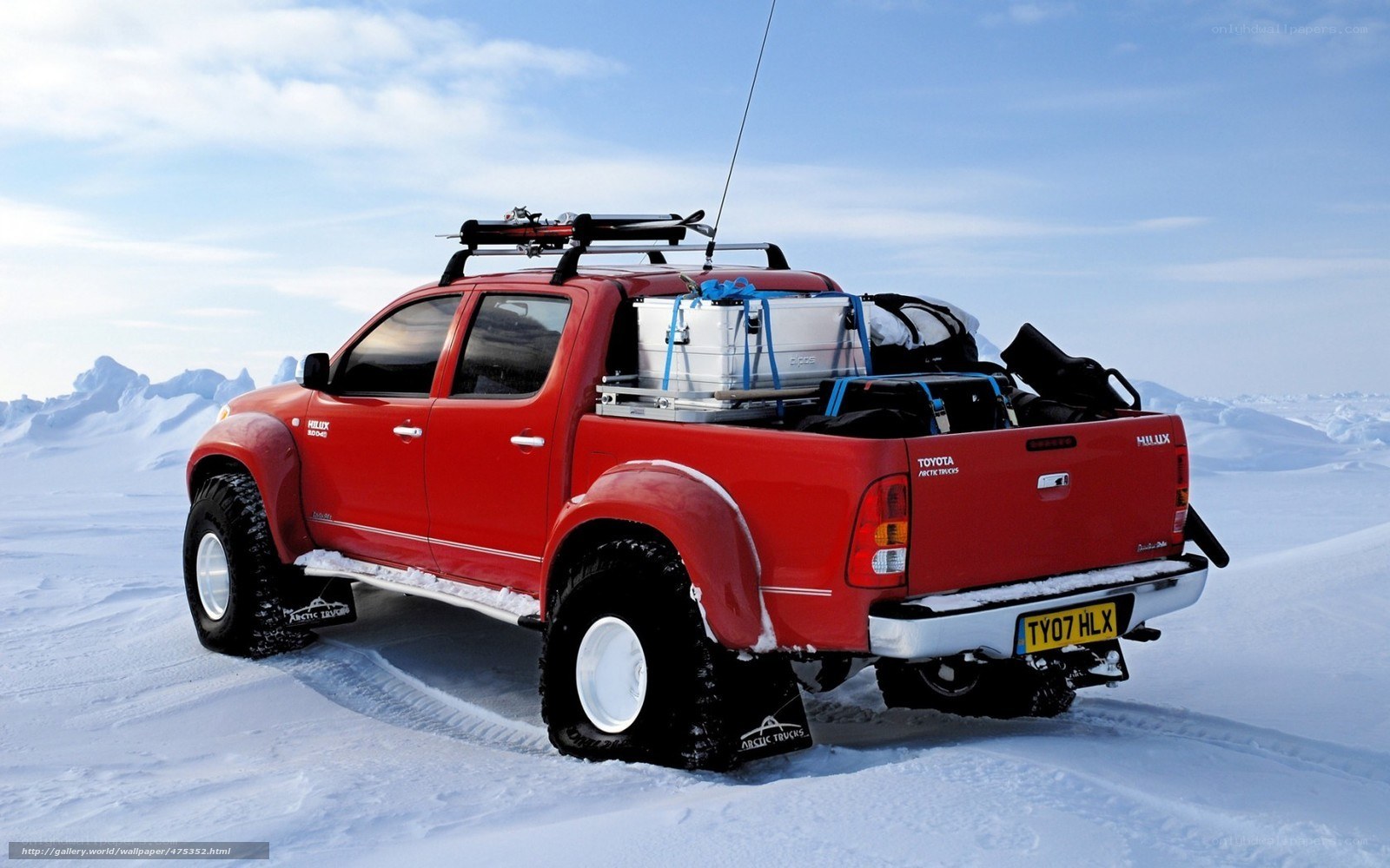 Red pickup in snowy landscape